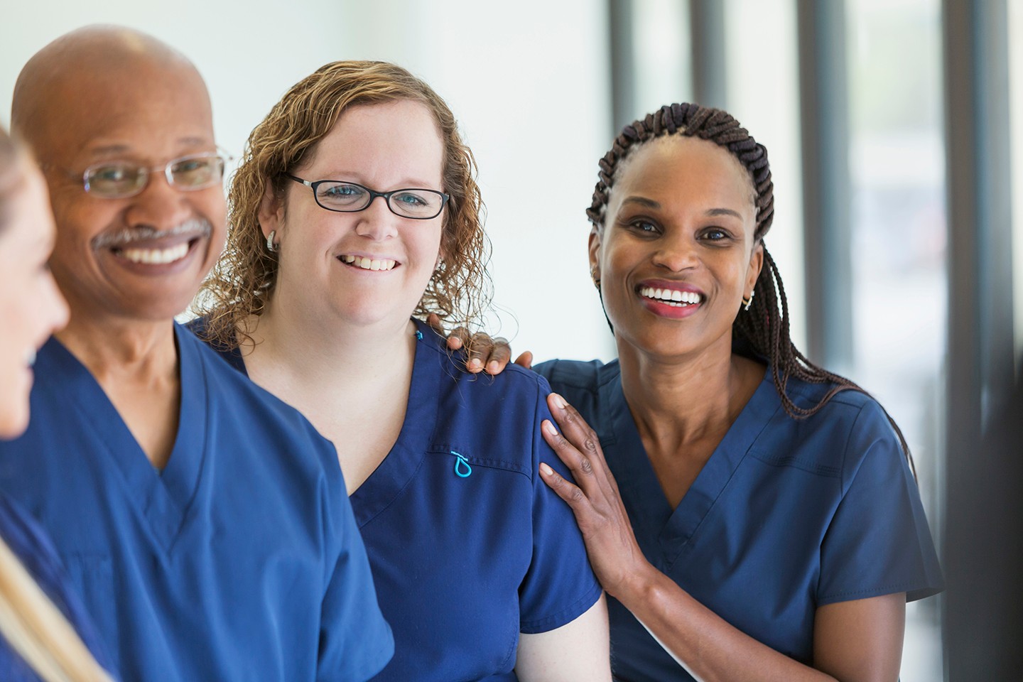 Three nurses smiling