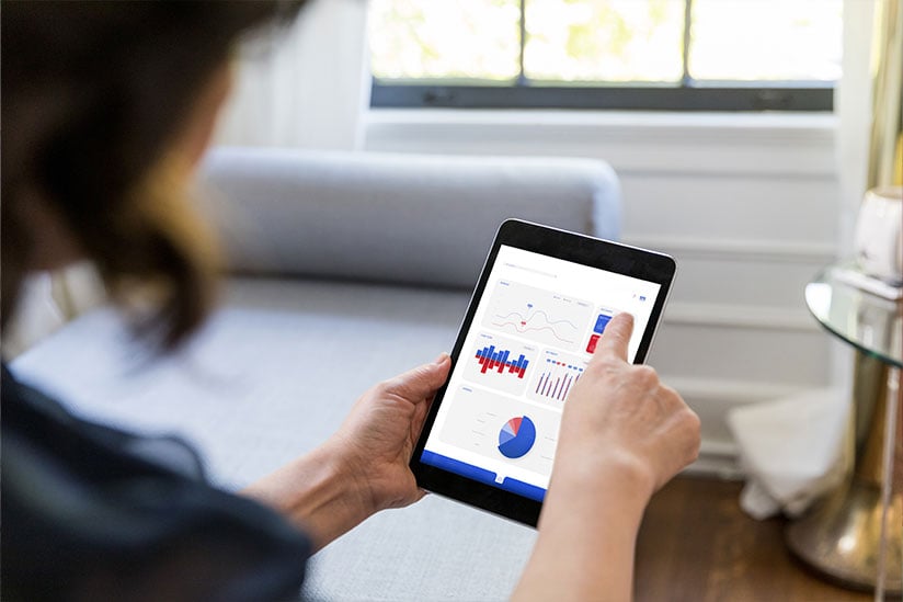 A nurse analyzes health statistics on a tablet, showcasing the impact of digital technology on modern nursing practices and patient data management. 