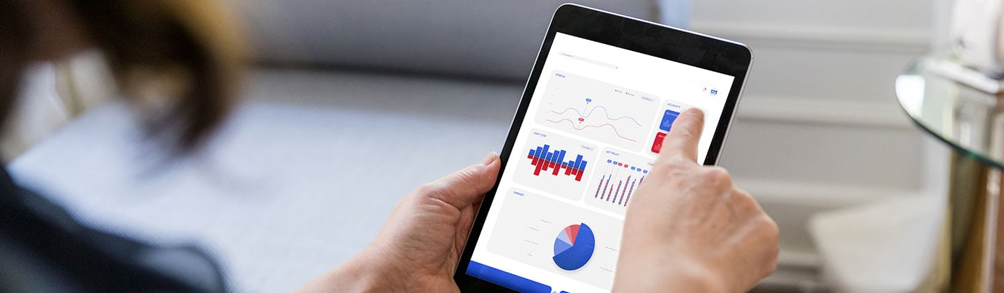 A nurse analyzes health statistics on a tablet, showcasing the impact of digital technology on modern nursing practices and patient data management. 