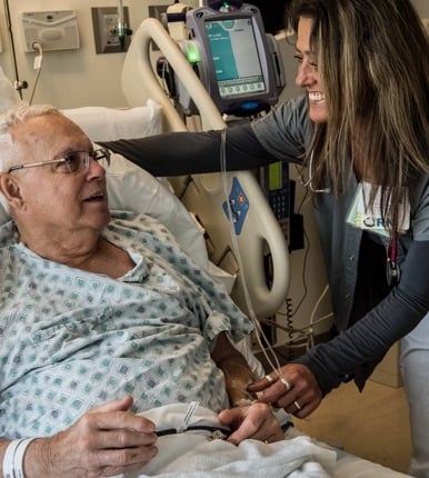 Nurse treating a patient tenderly