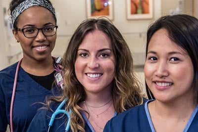 Group of nurses in blue scrubs