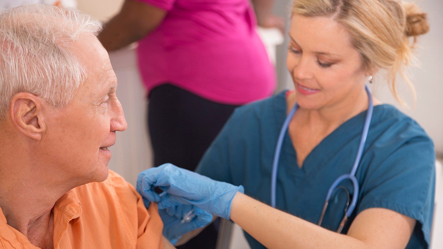 nurse giving immunization